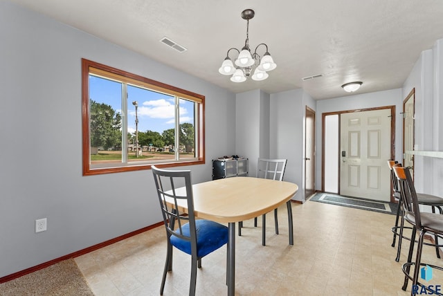 dining area featuring a chandelier