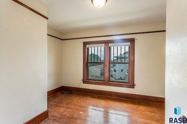 spare room featuring dark hardwood / wood-style flooring