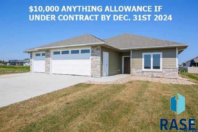 view of front of home with a garage and a front lawn