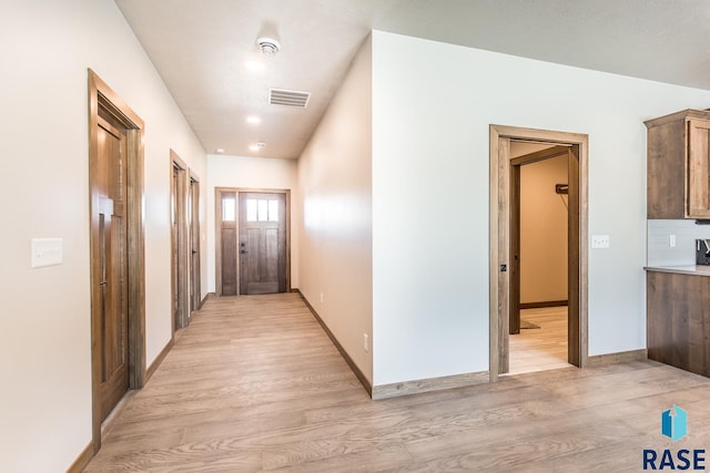 corridor featuring light wood-type flooring