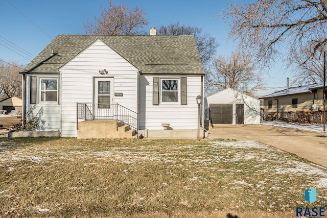 view of front of home with an outbuilding and a garage