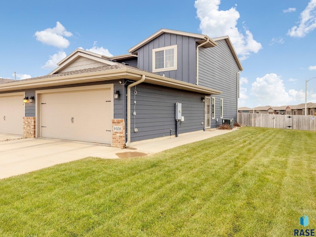 exterior space with a garage and a front yard