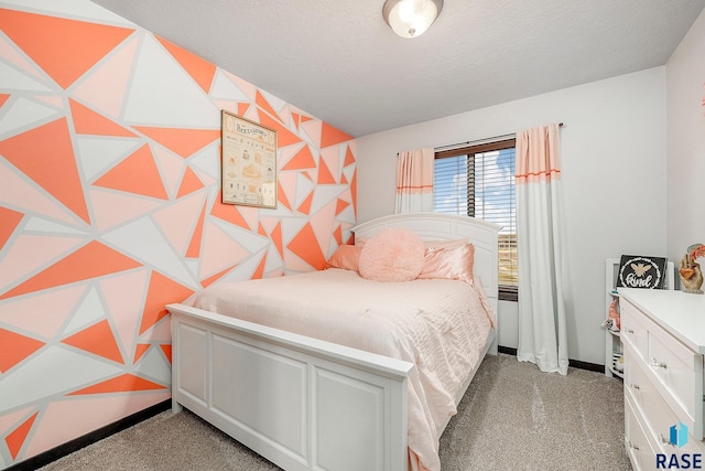 bedroom with light carpet and a textured ceiling