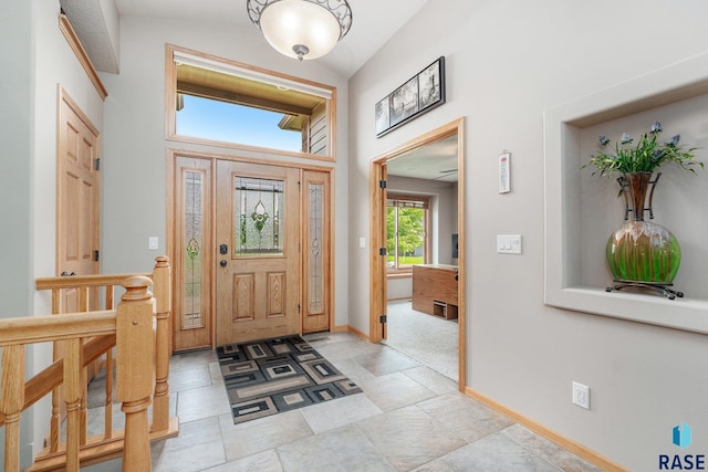 foyer entrance featuring lofted ceiling