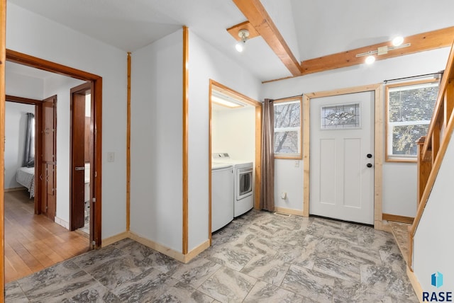 clothes washing area featuring independent washer and dryer and light hardwood / wood-style flooring