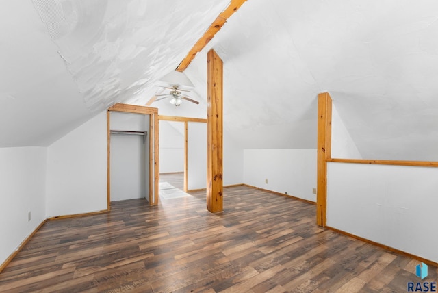 bonus room with dark hardwood / wood-style flooring, vaulted ceiling, and ceiling fan