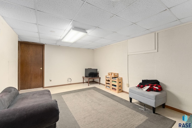 sitting room with a paneled ceiling