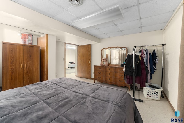 bedroom featuring a paneled ceiling