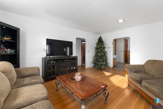 living room with a fireplace and light hardwood / wood-style floors