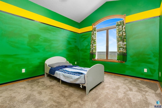 bedroom with carpet flooring and vaulted ceiling