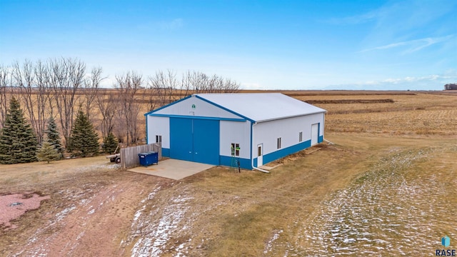 view of outbuilding featuring a rural view