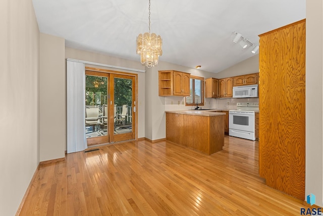 kitchen with pendant lighting, light wood-type flooring, white appliances, and kitchen peninsula