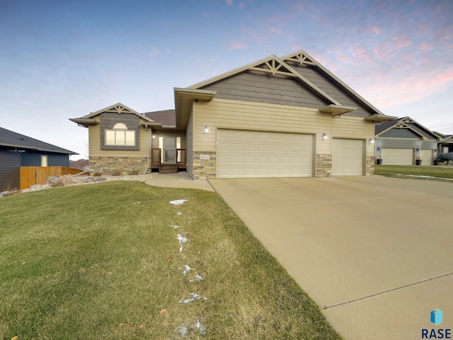 view of front of house with a lawn and a garage