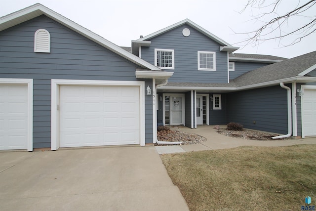 front of property with a garage