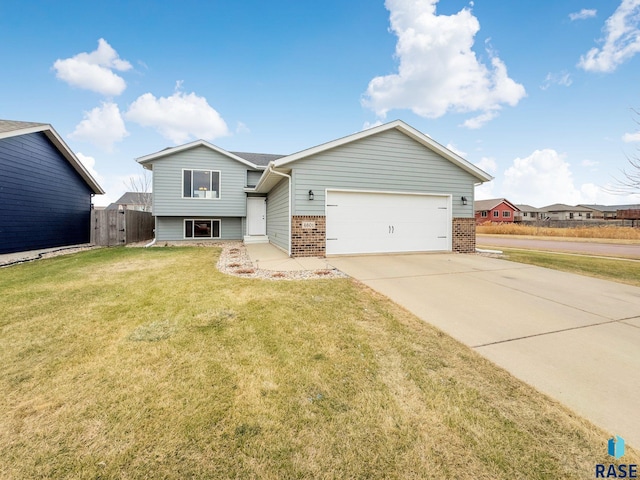 view of front of home with a front lawn and a garage