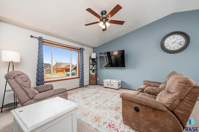 carpeted living room featuring vaulted ceiling and ceiling fan