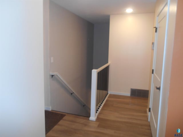 corridor with wood-type flooring