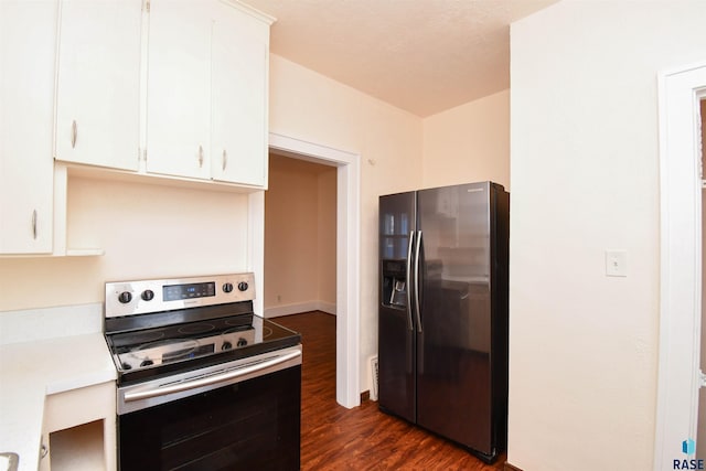 kitchen featuring white cabinets, a textured ceiling, stainless steel appliances, and dark wood-type flooring