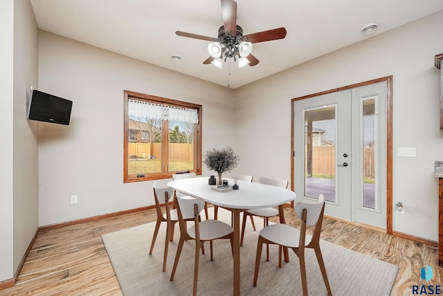 dining area featuring ceiling fan and light hardwood / wood-style floors