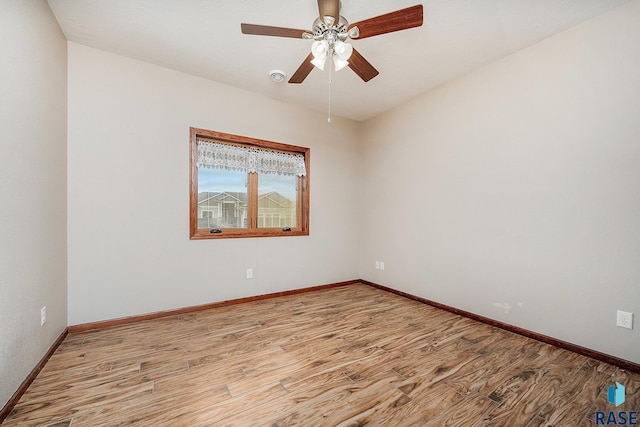 spare room with ceiling fan and light hardwood / wood-style floors