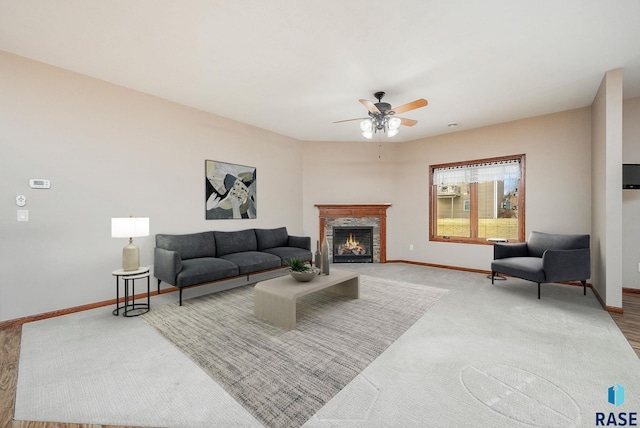 living room featuring ceiling fan and carpet floors