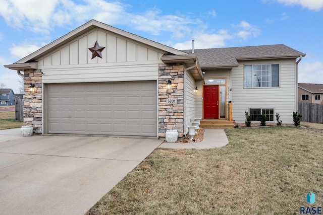 view of front of home featuring a garage and a front lawn