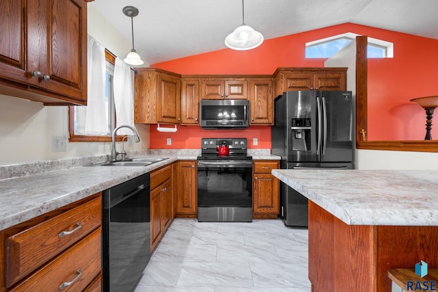 kitchen featuring sink, stainless steel appliances, hanging light fixtures, and vaulted ceiling