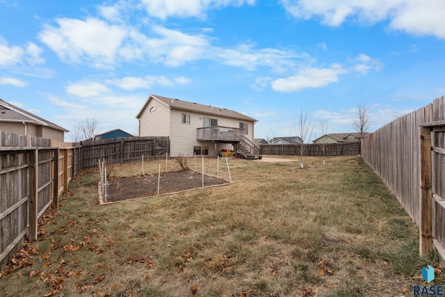 view of yard featuring a wooden deck