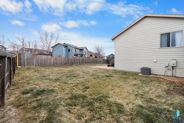 view of yard featuring cooling unit and a patio area