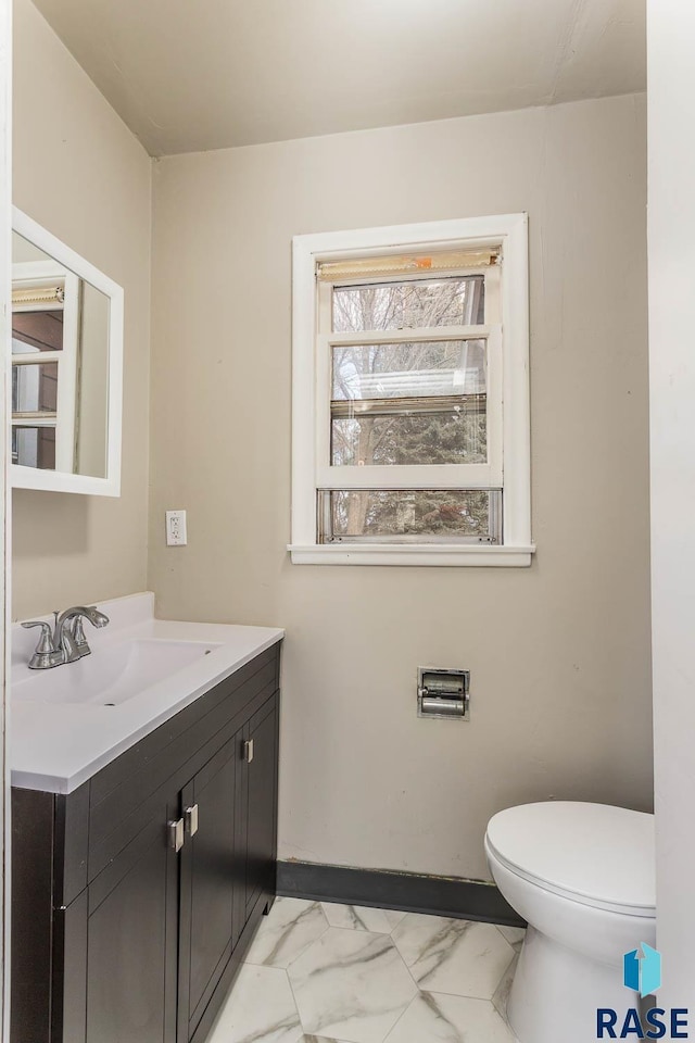 bathroom with vanity and toilet