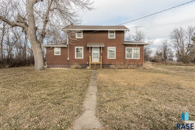 view of front of home with a front lawn