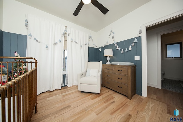 sitting room with ceiling fan and light hardwood / wood-style flooring