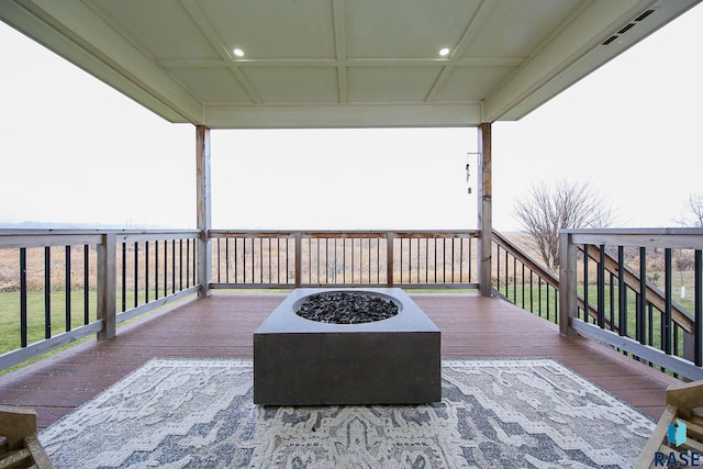 wooden deck featuring a fire pit