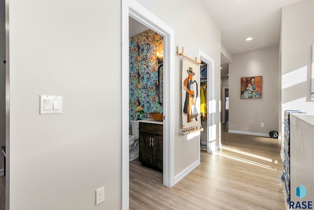 hall with light hardwood / wood-style floors