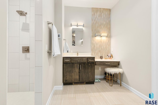 bathroom with a shower and vanity