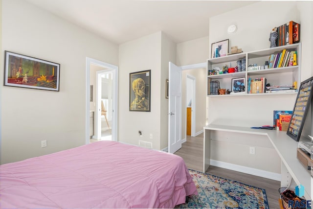 bedroom featuring dark hardwood / wood-style floors