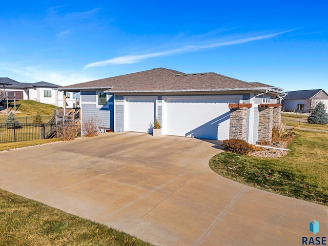 view of property exterior featuring a lawn and a garage