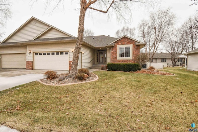 single story home featuring a front lawn and a garage