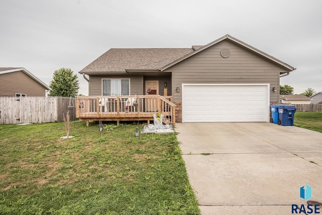 single story home featuring a wooden deck, a front yard, and a garage