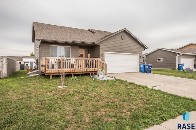 single story home featuring a wooden deck, a front lawn, and a garage