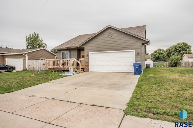 ranch-style house with a front lawn, a deck, and a garage