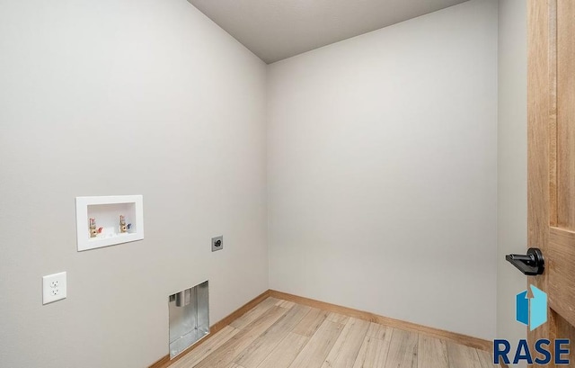 laundry room with light hardwood / wood-style flooring, washer hookup, and hookup for an electric dryer