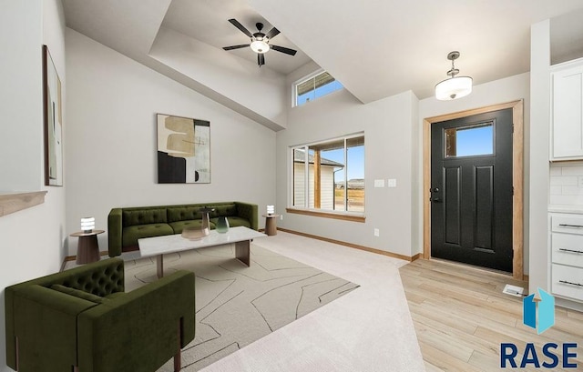 foyer with light hardwood / wood-style floors and ceiling fan