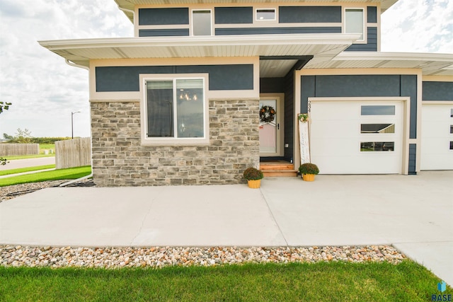 doorway to property featuring a garage