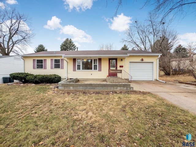 single story home with a front yard and a garage