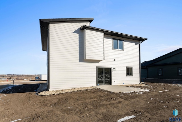 rear view of property featuring a patio area