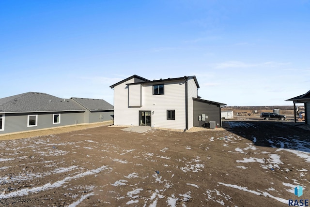 snow covered property with cooling unit