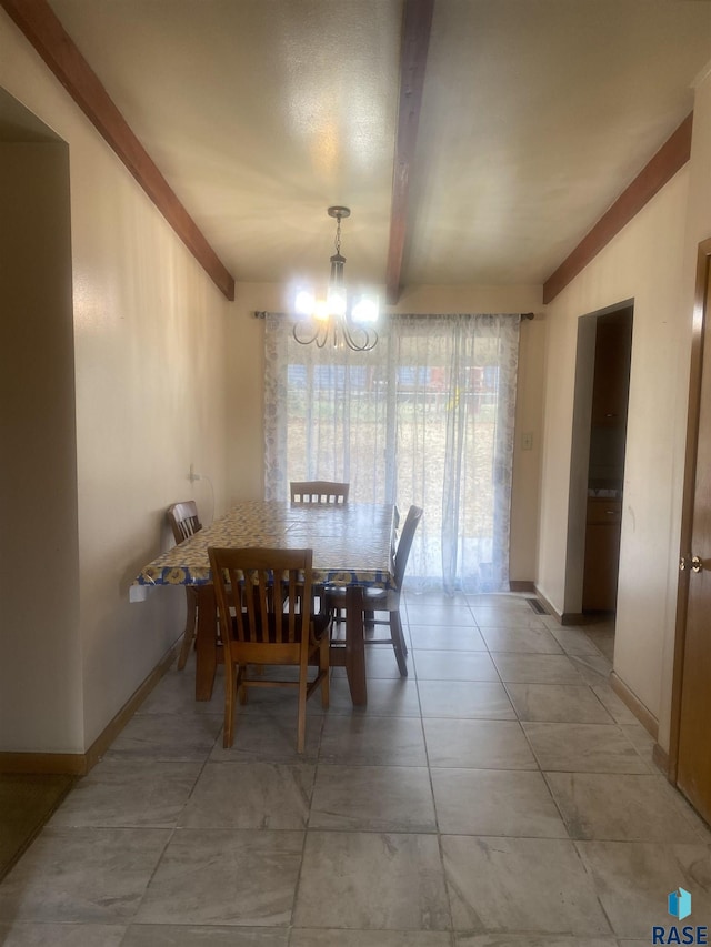 dining room with beamed ceiling and a chandelier