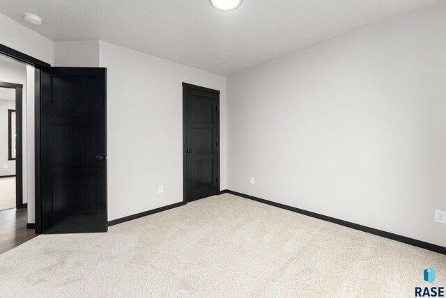 unfurnished bedroom with carpet flooring