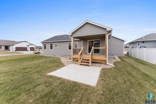 back of property featuring a yard and a deck